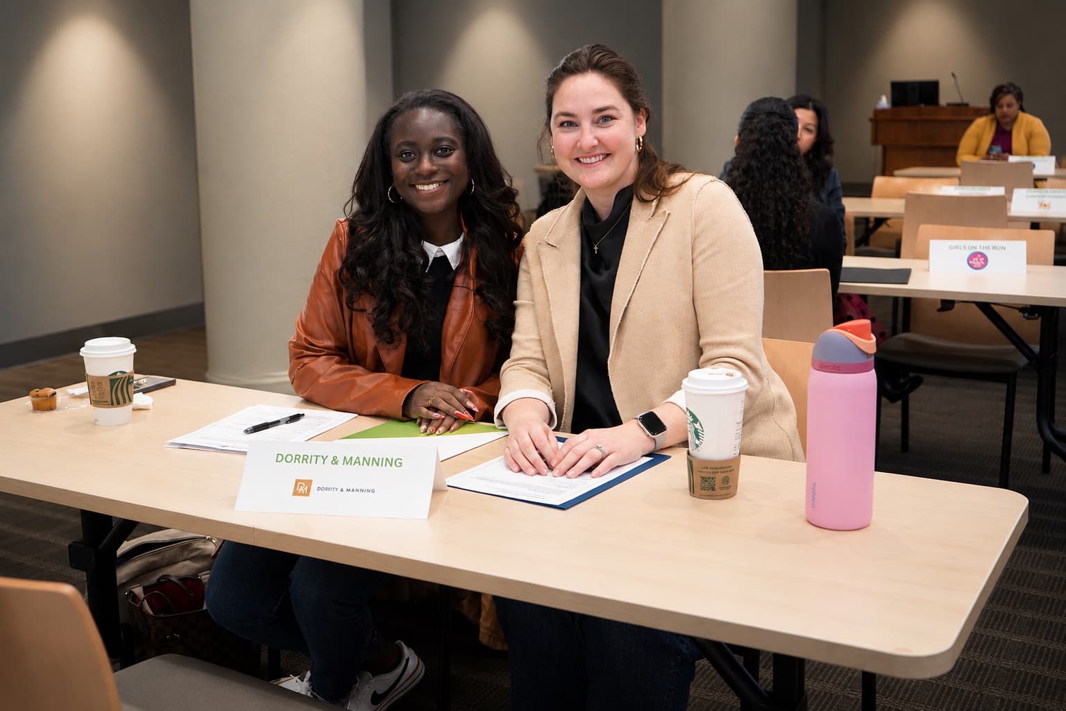 Two employers at a LaunchGVL Interview Day table